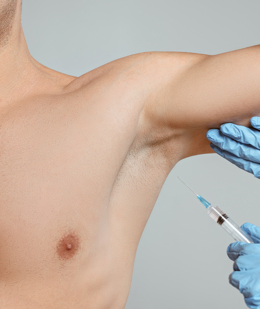Photo of a man receiving therapeutic injections in his armpit